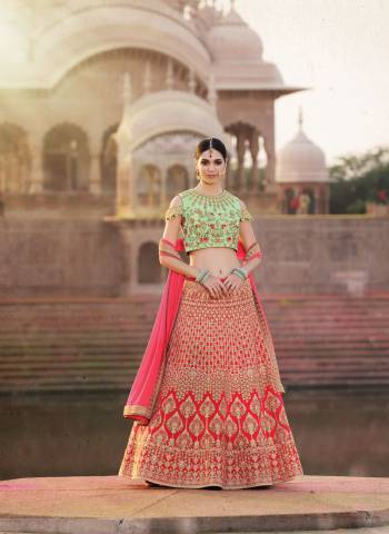 Look Pretty Wearing This Designer And Colorful Lehenga Choli In Pastel Green Colored Blouse Paired With Red Colored Lehenga And Pink Colored Dupatta. Its Blouse Is Fabricated On Georgette Paired With Art Silk Lehenga And Chiffon Dupatta. It Has Combination Of Intricate And Bold Both The Embroidery. Buy It Now.