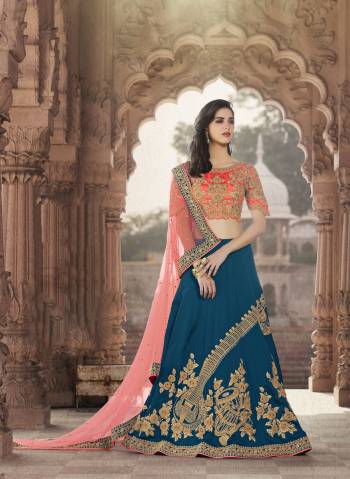 Celebrate This Festive Season With This Designer Lehenga And Flaunt Your Elegant Taste With it. Its Blouse Is In Orange Color Paired With Contrasting Blue Colored Lehenga And Light Pink Colored Dupatta. This Colorful Lehenga Choli Is Fabricated On Art Silk Paired With Net Fabricated Dupatta. Buy Now.