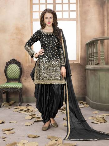 Enhance your Beauty With This Salwar Suit In Black Color Paired with Black Colored Bottom And Dupatta. Its Top Is Fabricated On Art Silk Paired With Santoon Bottom And Net Dupatta. Black Color Makes You Look Thin And Also It Will Earn You Lots Of Compliments From Onlookers.