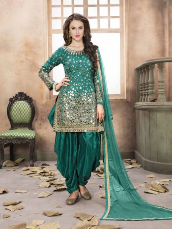 New And Unique Shade Is Here With This Salwar Suit In Teal Blue Color Paired With Teal Blue Colored Bottom And Dupatta. Its Top Is fabricated On Art Silk Paired With Santoon Bottom And Net Dupatta. Its All Three Fabrics Ensures Superb Comfort All Day Long.  Buy This Now.