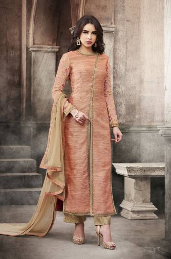 Look Pretty With This Peach Colored Designer Suit Paired With Beige Colored Bottom And Dupatta. Its Top Is Fabricated On Art Silk Paired With Jacquard Silk Bottom And Chiffon Dupatta. It Has Rich Embroidery Over The Sleeves Ans Neckline. Buy Now.