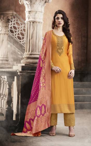 Bright And Visually Designer Dress Is Here Musturd Yellow Colored Straoght Designer Suit Paired With Musturd Yellow colored Bottom And Contrasting Rani Pink Colored Dupatta. Its Top And Bottom Are Fabricated On Art Silk Paired With Jacquard Silk Dupatta. Buy This Attractive Suit Now.