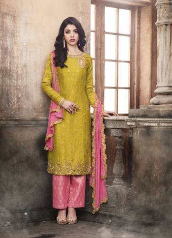 Add This Beautiful Designer Suit To Your Wardrobe In Pear Green Colored Top Paired With Contrasting Pink Colored Bottom And Dupatta. Its Top Is Fabricated On Art Silk Paired With Jacquard Silk Bottom And Chiffon Dupatta. Get This Stitched As A Lehenga Or Pants As Per Your Convinince. 