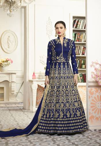 Shine Bright Wearing This Royal Blue Colored Floor Length Designer Suit Paired With Royal Blue Colored Bottom and dupatta. Its Top IS Fabricated On Art Silk Paired With Santoon Bottom And Chiffon Dupatta. IT Has Heavy Embroidery All Over The Top. Buy Now.