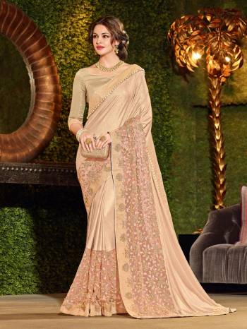 marvelously charming is what you will look at the next wedding gala wearing this beautiful beige color imported coated fabrics and jacquard border and with diamond and net fabrics with heavy work saree. Ideal for party, festive & social gatherings. this gorgeous saree featuring a beautiful mix of designs. Its attractive color and designer heavy embroidered design, patch design, moti, cut paste design, beautiful floral design work over the attire & contrast hemline adds to the look. Comes along with a contrast unstitched blouse.