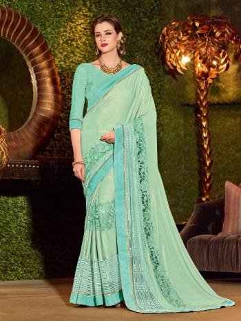 Bring out the best in you when wearing this sea green color imported coated fabrics and imported net jacquard fabrics and heavy sparkal sheet in border saree. Ideal for party, festive & social gatherings. this gorgeous saree featuring a beautiful mix of designs. Its attractive color and designer heavy embroidered design, beautiful floral design, cut paste design work over the attire & contrast hemline adds to the look. Comes along with a contrast unstitched blouse.