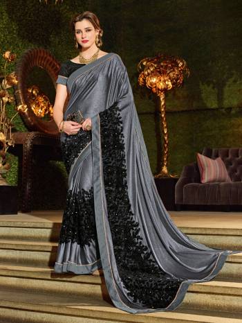 Vibrant and visually appealing, this grey and black color imported coated fabrics and imp net jacquard fabrics and jacquard border and diamond border saree. Ideal for party, festive & social gatherings. this gorgeous saree featuring a beautiful mix of designs. Its attractive color and designer heavy embroidered design, patch design, stone, cut paste design, beautiful floral design work over the attire & contrast hemline adds to the look. Comes along with a contrast unstitched blouse.