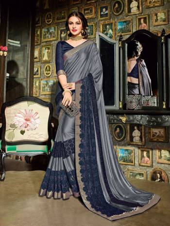 Wear this grey and navy blue color imported coated fabrics and net jacquard fabrics and jacquard border and diamond border saree. Ideal for party, festive & social gatherings. this gorgeous saree featuring a beautiful mix of designs. Its attractive color and designer heavy embroidered design, beautiful floral design, cut paste design work over the attire & contrast hemline adds to the look. Comes along with a contrast unstitched blouse.