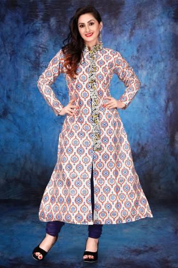 Long Kurti Patterned Suit Is Here In White Color Paired With Violet Colored Bottom. Its Printed Top Is Fabricated On Cotton Paired With Santoon Bottom. It Is Light In Weight And Easy To Carry All Day Long.