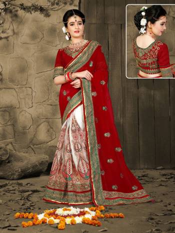 Adorn The Beautiful Queen Look Wearing This Saree In Maroon And White Color Paired With Maroon Colored Blouse. This Saree Is Fabricated On Georgette Paired With Gota Fabricated Blouse. It Is Durable And easy To Carry For.