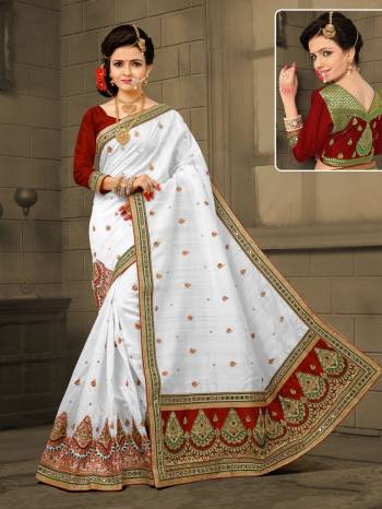 Celebrate This Festive Season Wearing This Saeee In White Color Paired With Rich Maroon Colored Blouse. This Saree Is Fabricated On Soft Art Silk Paired Wuth Art Silk Fabricated Blouse. It Has Beautiful Attractive Embroidery All Over The Saree.