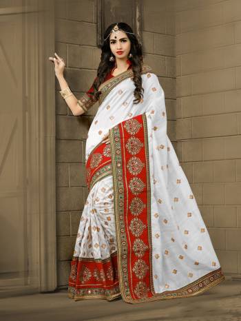 Celebrate This Festive Season Wearing This Saeee In White Color Paired With Rich Maroon Colored Blouse. This Saree Is Fabricated On Soft Art Silk Paired Wuth Art Silk Fabricated Blouse. It Has Beautiful Attractive Embroidery All Over The Saree.