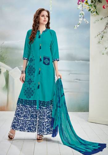 Grab This Readymade Plazzo Suit For Your Semi-Casual wear In New Shade Of Blue With Teal Blue Colored Straight Cut suit Paired With Blue Colored Bottom And Teal Blue Colored Dupatta. Its Top Is Fabricated On Rayon Cotton Paired With Cotton Bottom And Chiffon Dupatta. Buy This Suit Now.