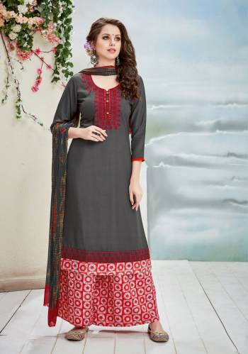 This Pretty Suit Is Designed As Per Your Comfort And Class. Its Top Is Dark Grey Color Paired With Red Colored Bottom And Dark Grey Dupatta. Its Top Is Fabricated On Rayon Cotton Paired With Cotton Bottom And Chiffon Dupatta. Its Fabrics Also Ensures Superb Comfort All Day Long. Buy This Readymade Suit Now.