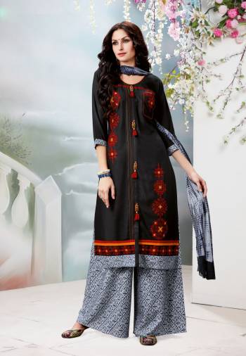 Enhance Your Beauty Wearing This Black Colored Straight Cut Suit Paired With Grey Colored Plazzo And Black Colored Dupatta. Its Top Is Fabricated On Rayon Cotton Paired With Cotton Bottom And Chiffon Dupatta. It Has Contrasting Emnroidery Over The Top. Buy This Readymade Suit Now.