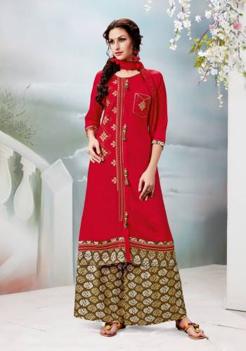 Adorn The Angelic Look Wearing This Straight Cut Suit In Red Color Paired With Contrasting Olive Green Colored Plazzo And Red Colored Dupatta. Its Top Is Fabricated On Rayon Cotton Paired With Cotton Bottom And Chiffon Dupatta. This Pretty Suit Will Earn You Lots Of Compliments From Onlookers And Also Ensures Superb Comfort All Day Long.