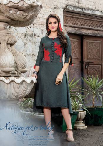 Flaunt Your Rich And Elegant Taste Wearing This Readymade Kurti In Dark Grey Color Fabricated On Art Silk. This Kurti Is Light In Weight And Easy To Carry All Day Long.