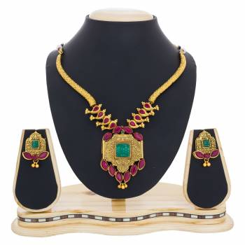 Simple and Elegant Looking Necklace Set Is Here Golden Color Beautified With Pink And Green Colored Stones. This Necklace set Be Paired With Any Traditonal Attire. Buy Now.