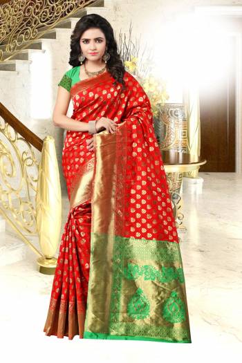 Adorn The Pretty Angelic Look Wearing This Banarasi Saree In Red Color Paired With Contrasting Green Colored Blouse. This Saree And Bloiyse Are Fabricated On Banarasi Art Silk Beautified With Weave All Over It. Buy This Saree Now.