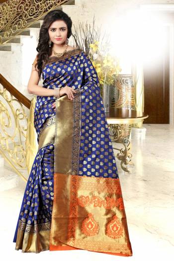 In This Beautiful Saree, Blue Is Combined With Attractive Colored Blouse In Orange. This Saree And Blouse Are Fabricated On Banarasi Art Silk Beautified With Weave All Over It. This Saree Is Light Weight And Easy To Drape. Buy Now.