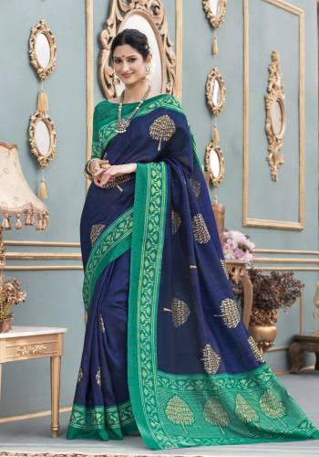 Enhance Your Personality Wearing This Elegant Formal Saree In Navy Blue Color Paired With Contrasting Teal Green Colored Blouse. This Saree And Blouse Are Fabricated On Tussar Art Silk Beutified With Bold Prints. Buy This Saree Now.