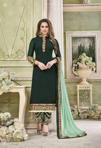 Grab This Designer Straight Cut Suit In Dark Green Color Paired With Contrasting Pastel Green Colored Dupatta. Its Top Is Fabricated On Georgette Paired With Santoon Bottom And Chiffon Dupatta. All Three Fabrics Are Beautified With Embroidery. Buy This Semi-Stitched Suit Now.