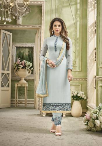 Flaunt Your Rich and Elegant Taste With This New and Unique Shade Of Blue With This Straight Cut Suit In Baby Blue Color. Its Embroidered Top IS fabricated On Georgette Paired With Embroidered Santoon Bottom And Chiffon Dupatta. Its All Three Fabrics Ensures Superb Comfort All Day Long. Buy Now.