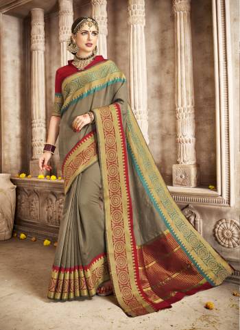 Get Ready For The Next Social Function At Your Place With This Khakhi Colored Saree Paired With Red Colored Blouse. This Saree And Blouse Are Fabricated On Cotton Silk With Weave Over The Saree Border. Buy It Now.