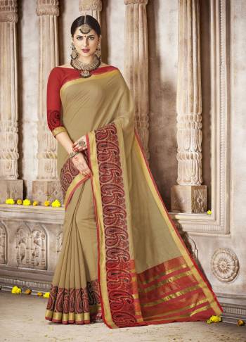 Enhance Your Beauty Wearing This Khakhi Colored Saree Paired With Red Colored Blouse. This Elegant Saree And Blouse Are Fabricated On Cotton  Silk Which Is Easy To Drape And Carry All Day Long. 