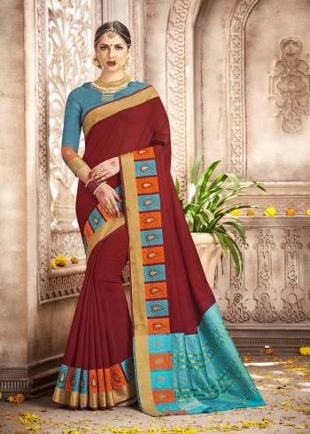 Flaunt Yor Rich Taste With This Sophistucated Maroon Colored Saree Paired With Blue Colored Blouse. This Saree And Blouse Are Fabricated On Cotton Silk Which Is Soft Towards Skin And Easy To Carry All Day Long.