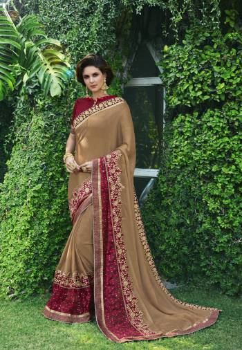 Rich And Royal Looking Saree Is Here In Light Brown Color Paired With Maroon Colored Blouse. This Saree Is Fabricated On Chiffon Paired With Art Silk Fabricated Blouse. It Has Attractive Embroidery Over The Lace Border Which Will Earn You Lots Of Compliments From Onlookers.