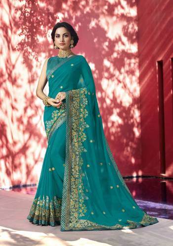 Add This Lovely Saree To Your Wardrobe In Turquoise Blue Color Paired With Turquoise Blue Colored Blouse. This Saree Is Fabricated On Georgette Paired With Art Silk Fabricated Blouse. Its Lovely Color Will Earn You Lots Of Compliments From Onlookers.