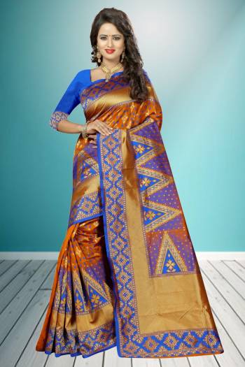 Bright And Visually Appelaing, Grab This Lovely Orange And Blue Colored Saree Paired With Blue Colored Blouse. This Saree And Blouse are Fabricated On Banarasi Art Silk With Golden Jacquard Work All Over.