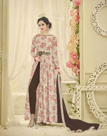 Grab This Indo-Western Suit In Pale Grey Color Paired With Brown Colored Bottom And Dupatta. Its Printed Top Is Fabricated On Satin Paired With Santoon Bottom And Chiffon Dupatta. Its Has Pretty Bold Floral Prints All Over The Top. Buy It Now.