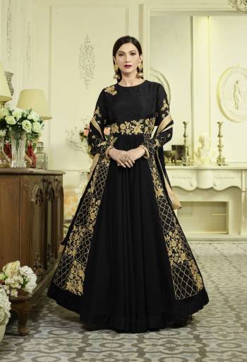 Enhance Your Beauty Wearing This Designer Floor Length Suit In Black Color Paired With Black Colored Bottom And Dupatta. Its Top Is Fabricated On Georgette Paired With Santoon Bottom And Chiffon Dupatta. It Has Attractive Golden Colored Embroidery Which Is The Main Highlight Of This Suit. Buy This Suit Now.