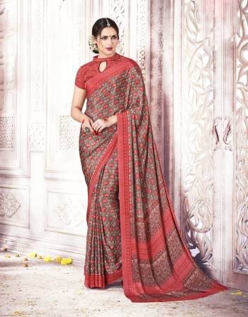 As Per Your Comfort, Grab This Pretty Casual Saree In Grey And Orange Color Paired With Oarnge Colored Blouse. This Saree And Blouse Are Fabricated On Crepe Silk Beautified With Intricate Prints All Over It. This Saree Is Light In Weight And Easy To Carry All Day Long.