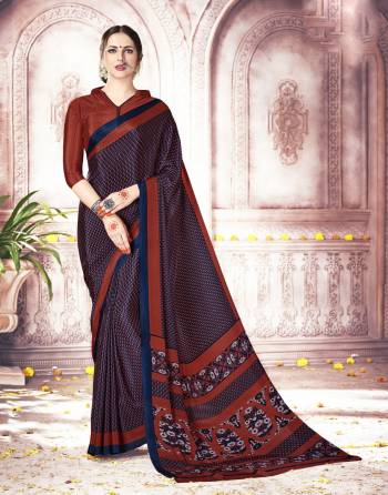 For Your Casual Wear, Grab This Pretty Saree In Navy Blue And Maroon Color Paired With Maroon Colored Blouse. This Saree And Blouse Are Fabricated On Crepe Silk Beautified with Simple Prints All Over It. Buy This Saree Now.