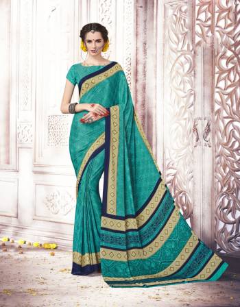 Look Beautiful and Attractive Wearing This Saree In Blue Color Paired With Blue Colored Blouse. This Saree And And Blouse Are Fabricated On Crepe Silk With Tone To Tone Prints Over The Saree. Buy This Pretty Saree Now.