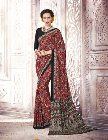 Here Is Saree Which Suits Your Personality, Grab This Saree In Red And Multi Color Paired With Black Colored Blouse. This Saree And Blouse Are Fabricated On Crepe Silk Beautified With Small Prints All Over It. Buy This Saree Now.