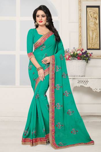 Here Is A Pretty Shade Of Green With This Saree In Sea Green Color Paired With Sea Green Colored Blouse. This Saree And Blouse Are Fabricated On Georgette Beautified With Embroidered Patch Work. Buy This Now.