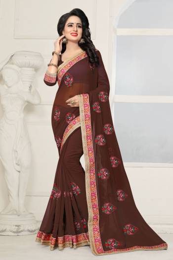 You Will Definitely Earn Lots Of Compliments Wearing This Rich Saree In Brown Color Paired With Brown Colored Blouse. This Saree And Blouse Are Fabricated On Georgette Beautified With Resham And Stone Work. 