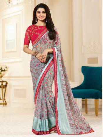 Grab This Beautiful Designer Saree In Aqua Blue Color Paired With Dark Pink Colored Blouse. This Saree Is Fabricated On Georgette Beautified With Contrasting Dark Pink Colored Prints Paired With Dark Pink Colored Embroidered Blouse. This Saree Is Light In Weight And Easy To Carry All Day Long.