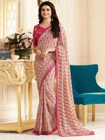 Look Pretty Wearing This Saree In Pastel Pink Color Paired With Dark Pink Colored Blouse. This Saree Is Fabricated On Georgette Paired With Art Silk Fabricated Blouse. It Is Beautified With Floral Prints And Embroidery. Buy This Designer Saree Now.