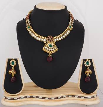 Feel Like A Queen Wearing This Rich And Elegant Necklace Set In Golden Color Beautified With Multi Colored Stones. It Is Light In Weight And Easy To Carry All Day Long.