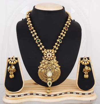 Feel Like A Queen Wearing This Rich And Elegant Necklace Set In Golden Color Beautified With Multi Colored Stones. It Is Light In Weight And Easy To Carry All Day Long.