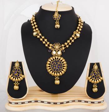 Earn Lots Of Compliments Wearing This Attractive Necklace Set In Golden Color Beautified with Navy Blue Colored Stone Work. This Can be Paired With Navy Blue Or Any Contrasting Colored Attire. Buy Now.