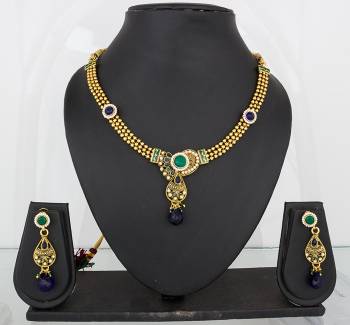 Earn Lots Of Compliments Wearing This Attractive Necklace Set In Golden Color Beautified with Navy Blue Colored Stone Work. This Can be Paired With Navy Blue Or Any Contrasting Colored Attire. Buy Now.