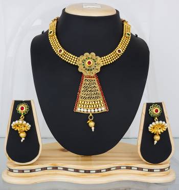 Feel Like A Queen Wearing This Rich And Elegant Necklace Set In Golden Color Beautified With Multi Colored Stones. It Is Light In Weight And Easy To Carry All Day Long.