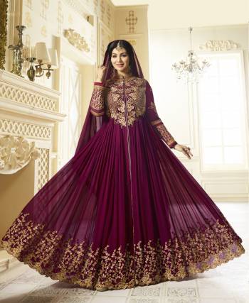 New And Unqiue Shade Is Here With This Designer Floor Length Suit In Wine Color Paired With Wine Colored Bottom And Dupatta. Its Top Is Fabricated On Georgette Paired With Santoon Bottom And Chiffon Dupatta. Its Heavy Yoke And Panel Will Give Heavy Look To Your Personality.