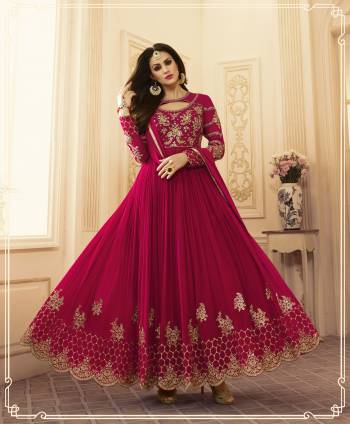 Bright And Visually Appealing Color Is Here With This Designer Floor Length Suit In Dark Pink Color Paired With Dark Pink Colored Bottom And Dupatta. Its Top Is Fabricated On Georgette Paired With Santoon Bottom And Chiffon Dupatta. Its Has Detailed HEavy Embroidery Over The Yoke and Panel. Buy This Lovely Designer Suit Now.